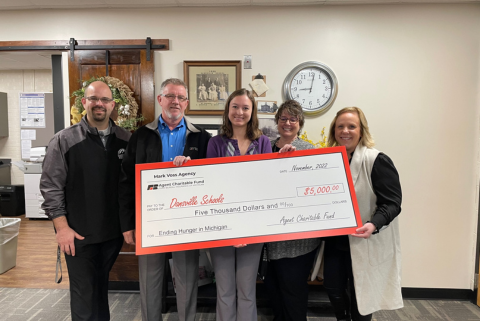 Mark Giving Check to Dansville Public Schools